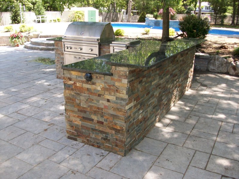 outdoor kitchen island with granite counter top